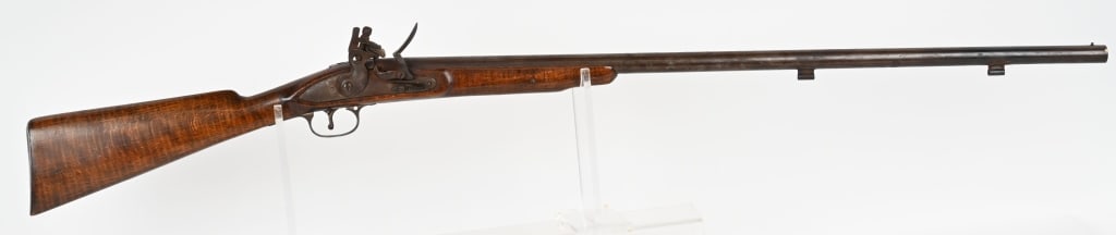 COMPOSITE EAST INDIA STYLE FLINTLOCK SHOTGUN: SERIAL NUMBER: NSN BARREL: 30 3/4" CALIBER: About .16 gauge. Original flintlock configuration with Rampant Lion on lock. Has British proofs on breech of barrel. CONDITION:. Fair, East India Rifle alte