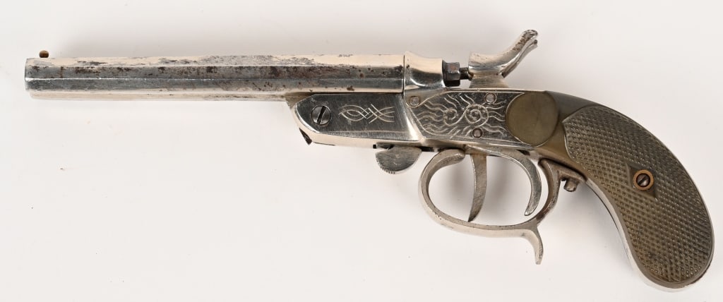JCE .32 GARRUCHA DOUBLE BARREL CARTRIDGE PISTOL: SERIAL NUMBER: NSN. BARREL: 4 7/8". CALIBER: .32. This double barrel cartridge pistol features two trigger operation, nickel finish, strong action and engraving on frame. CONDITION: The pistol retains