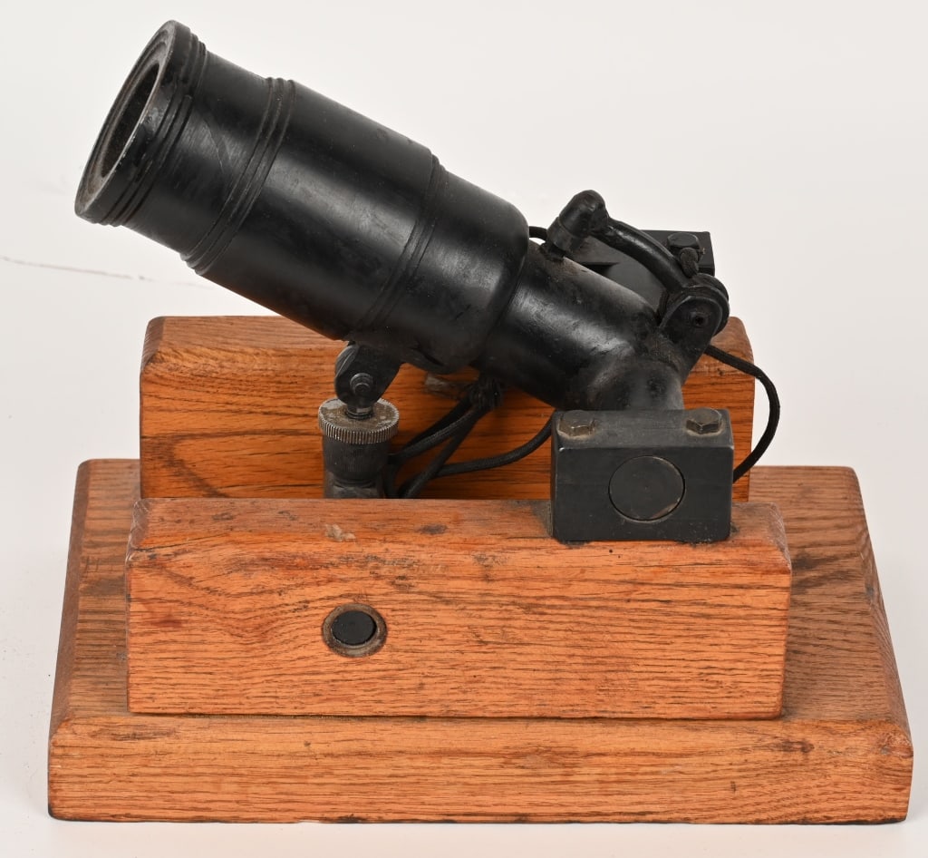 BLACK POWDER CANNON: This very cool cannon features a 5 inch barrel with a bore diameter of 1 3/4", elevation adjustment, string trigger and sits on a wood cradle. Just add black powder, percussion cap and pull the string