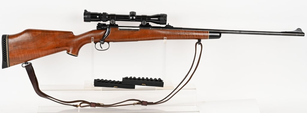 GERMAN MAUSER 98 BOLT ACTION SPORTERIZED RIFLE: SERIAL NUMBER: 22925. BARREL: 24". CALIBER: 8MM MAUSER. This sporterized Mauser has a smooth wood Monti Carlo style stock, blued barrel and action, internal box magazine, leather sling, (2) 9 round ny