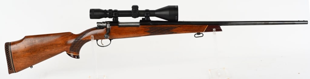 FIREARMS CO. ENGLAND MODEL 98 BOLT ACTION.: SERIAL NUMBER: P-56554 BARREL: 24" CALIBER: 30-06 SPRG. MANUFACTURED: 1970-1974 Blue High polished steel with Jeweled bolt. with Simmons 3-9 x 50 scope mounted. Grade 2 Custom walnut stock with rubber