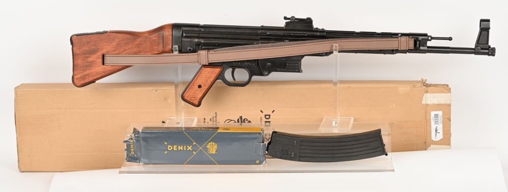 WWII GERMAN STG 44 ASSAULT RIFLE REPLICA BY DENIX: This replica recreates the first assault rifle in great details from the wood stock, solid metal construction to the mechanical details that give it a realistic look and feel. The rifle features an ej