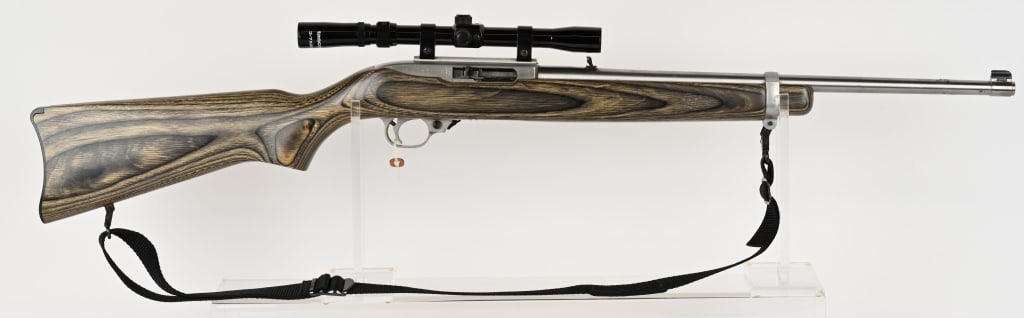 RUGER ST STEEL 10/22 SEMI AUTO RIFLE W/ SCOPE: SERIAL NUMBER: 242-19107. BARREL: 18 ?". CALIBER: 22LR. MANUFACTURED: 1995. This rifle features: stainless steel barrel, receiver and trigger group, gray laminated stock, (1) Ruger detachable rotary m