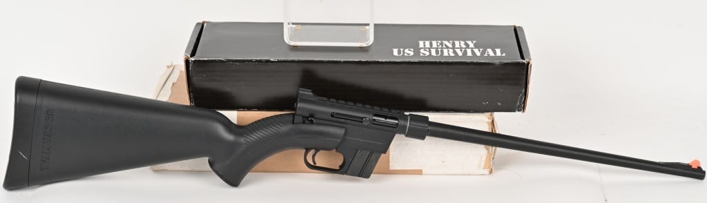 HENRY AR-7 US SURVIVAL RIFLE WITH BOX: SERIAL NUMBER: US009756B.. BARREL: 16". CALIBER: .22LR. MANUFACTURED: 2010's. Henry's take on the original AR-7 design. Orange polymer blade front sight and rear peep. Heavy black finish and black pol
