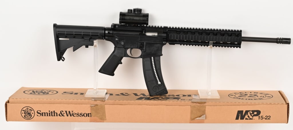 SMITH & WESSON M&P 15-22P SEMI AUTO RIFLE: SERIAL NUMBER: HCL3713. BARREL: 16.5". CALIBER: 22 LR. Smith & Wesson, M&P 15-22 Sport, quad rail semi-automatic rifle. It has a threaded 1/2X28 barrel with bird cage flash hider. Pic Tinny A2 style r