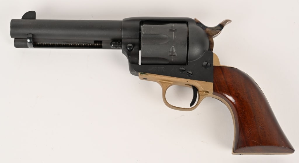 ITALIAN UBERTI SAA REVOLVER IN .45 COLT: SERIAL NUMBER: J06744. BARREL: 4-3/4". CALIBER: .45 COLT. MANUFACTURED: 2001. Made in Italy and imported by Cabellas. Six shot fluted cylinder. Blade front sight and u-notch rear. Matte blued finish, 