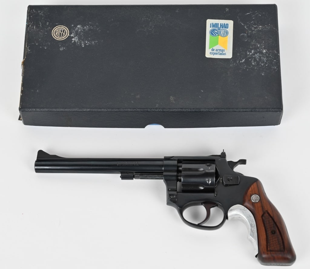 ROSSI MODEL 51 REVOLVER 22LR WITH FACOTRY BOX: SERIAL NUMBER: A889901. BARREL: 6". CALIBER: .22LR. MANUFACTURED: EARLY 1980s. Six shot fluted cylinder. Blade front sight and u-notch rear. Original blued finish and checkered yellow grips. Tyler's G