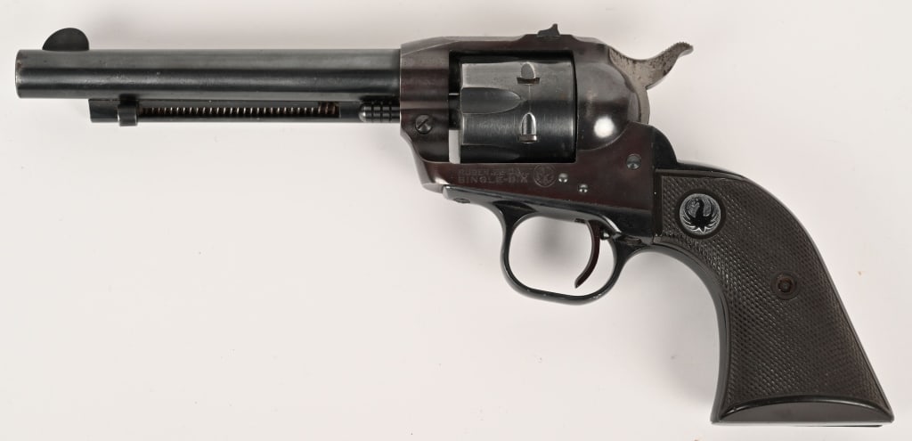 RUGER NEW MODEL SINGLE SIX .22 LR. REVOLVER: SERIAL NUMBER: 68308. BARREL: 5 1/2". CALIBER: 22LR. MANUFACTURED: 1950s. Standard six shot single action with blue finish, target adjustable rear sight, high blade front sight and walnut two piece gr