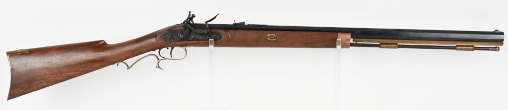 NAVY ARMS CO 50 CAL FLINTLOCK MUZZLE LOADER: SERIAL NUMBER: 01521. BARREL: 25". CALIBER: 50. This black powder rifle features, wood Monte Carlo stock, blued octagonal barrel, fixed front blade sight and u notch rear sight, black firing assembly,