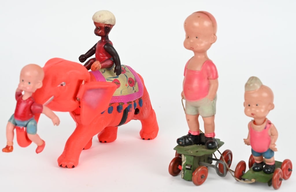 HENRY ON ELEPHNAT & HENRY WITH BROTHER: Includes Henry and Mahut on Elephant. Scarce orange color. All original and work. Plus Henry with his Brother. All original with nice colors. Brother has small dent in back of his head. Both toys wind