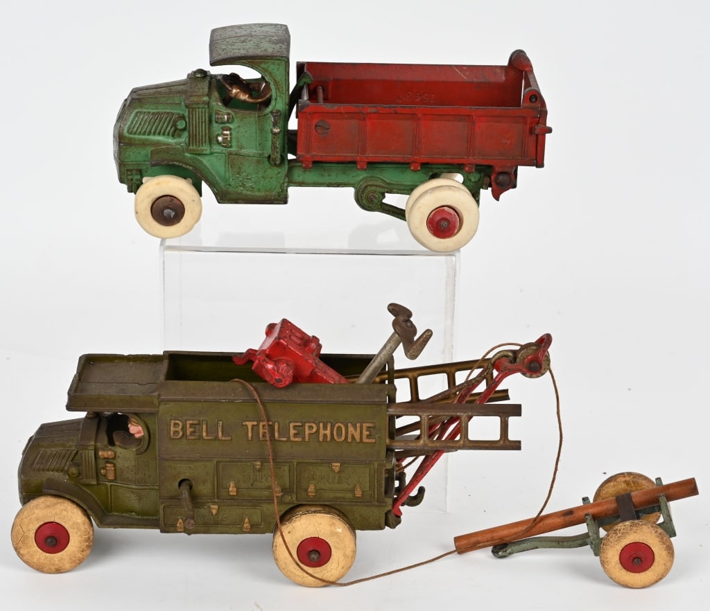 HUBLEY CAST IRON MACK BELL & DUMP TRUCKS: Both large versions in all original condition. Bell Truck comes with accessories. Both in decent condition. Some rubber tires replaced. Dump measures 10 1/2" Very Good-Excellent