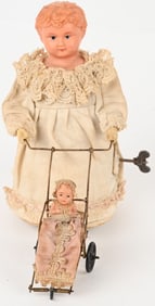 GERMAN WINDUP CELLULOID LADY & BABY BUGGY