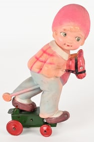 JAPAN CELLULOID WINDUP GIRL ON HOBBY HORSE
