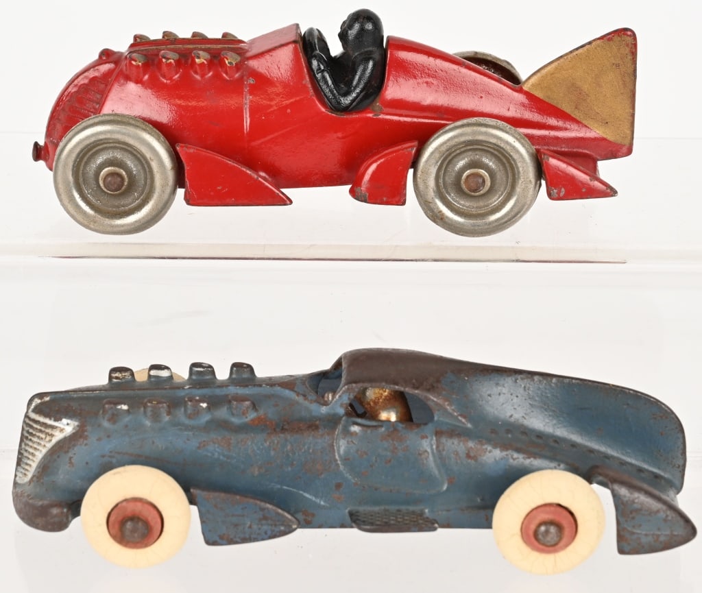 2- HUBLEY CAST IRON RACE CARS: Lot includes : 1. 6 1/2" Red Boat tail racer, Great all original condition. Right front wheel is loose. No cracks or repairs. Excellent, 2. 7 1/2 Blue Closed Cockpit racer. All original, No cracks or 