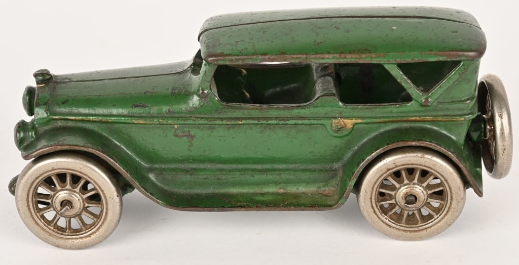 A.C. WILLIAMS CAST IRON LINCOLN TOURING CAR: Original paint and nickel plated wheels. There is a hairline crack on the left windshield bar. 7" Excellent