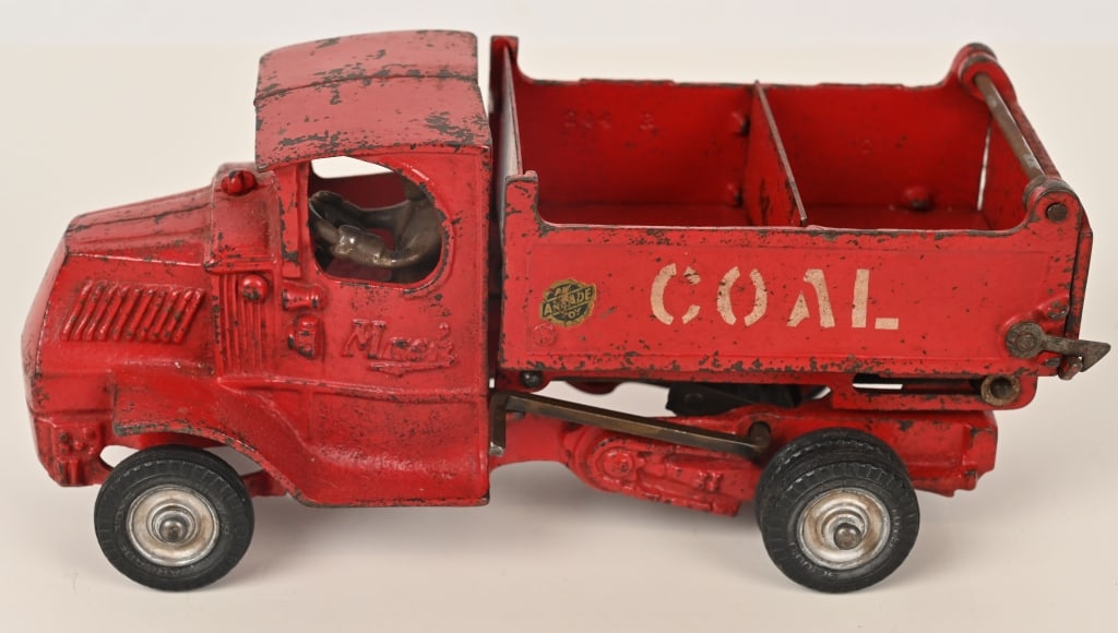 ARCADE CAST IRON MACK HIGH LIFT COAL TRUCK: Complete and original Arcade Mack high lift Coal Dump Truck. No cracks or repairs. Nice Arcade sticker on left side of bed. Includes original bed divider that is often missing. A very nice example of 
