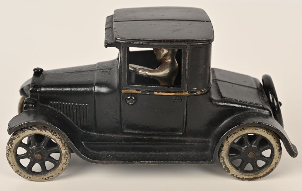 ARCADE CAST IRON CHEVROLET SUPERIOR COUPE: Arcade cast iron Chevrolet Superior Utility Coupe. All original with nice paint and nickel plated driver. . Has great Chevrolet bowtie stencils on radiator and spare wheel. No cracks or repairs. 6 3/4