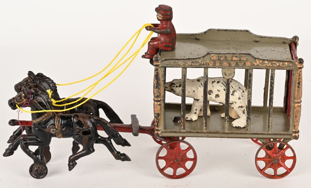 HUBLEY CAST IRON ROYAL CIRCUS WAGON w/ BEAR: Mid size Hubley Royal Circus horse drawn cage wagon with Polar Bear. All original condition with no cracks or repairs. Correct driver and bear. 13" Very Good-Excellent