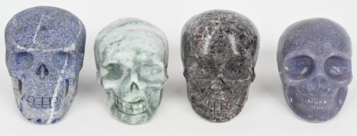 4- CARVED STONE SKULLS