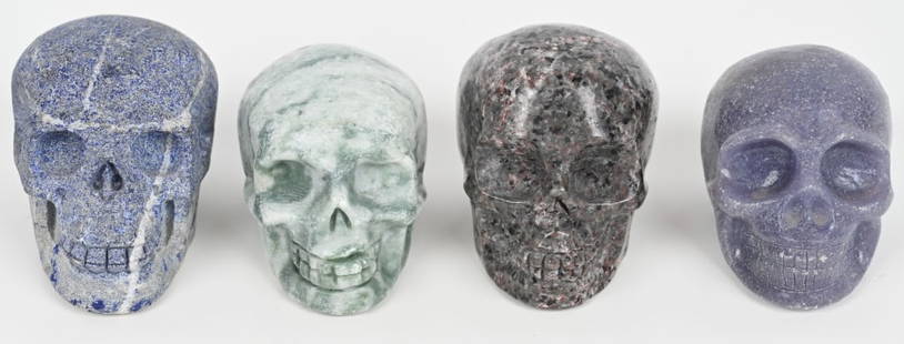 4- CARVED STONE SKULLS: very nicely carved of different stone specimens. Largest is 4 1/2" Excellent