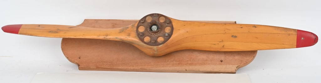 ANTIQUE WOOD AIRPLANE PROPELLER: Nice small size wood airplane propeller mounted on a wood bracket. Very well made. No makers mark, but probably made by U.S. Propellers Inc. . Still retains metal brakets for attaching to motor. 44" E