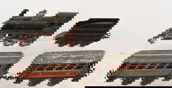 BUBB CLOCKWORK O GA PASSENGER TRAIN SET: Bubb clockwork O gauge American Engine and Tender with 2 Passenger Cars. All original with some wear. Very Good