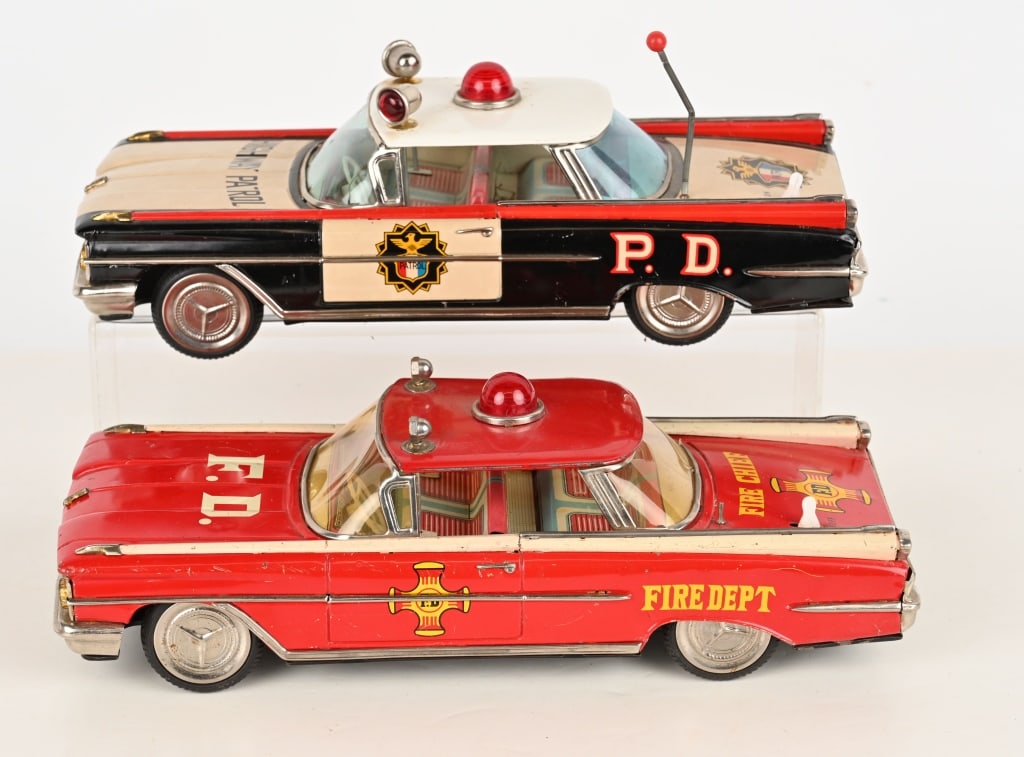 JAPAN TIN FRICTION OLDS HIGHWAY PATROL & FIRE CAR: Both all original and frictions work. Fire car missing battery door. 12" Very Good-Excellent
