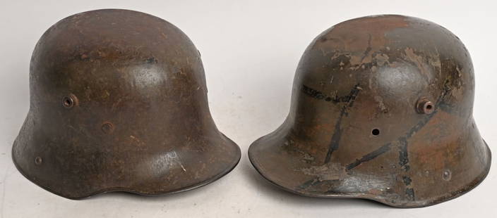 WWI IMPERIAL GERMAN HELMET LOT W CAMO WW1: WWI Imperial German helmet lot to include 1)&#160;WW1 IMPERIAL GERMAN CAMO HELMET WWI. The stamped, sheet steel construction helmet retains a good portion of its original hand applied Camo field paint