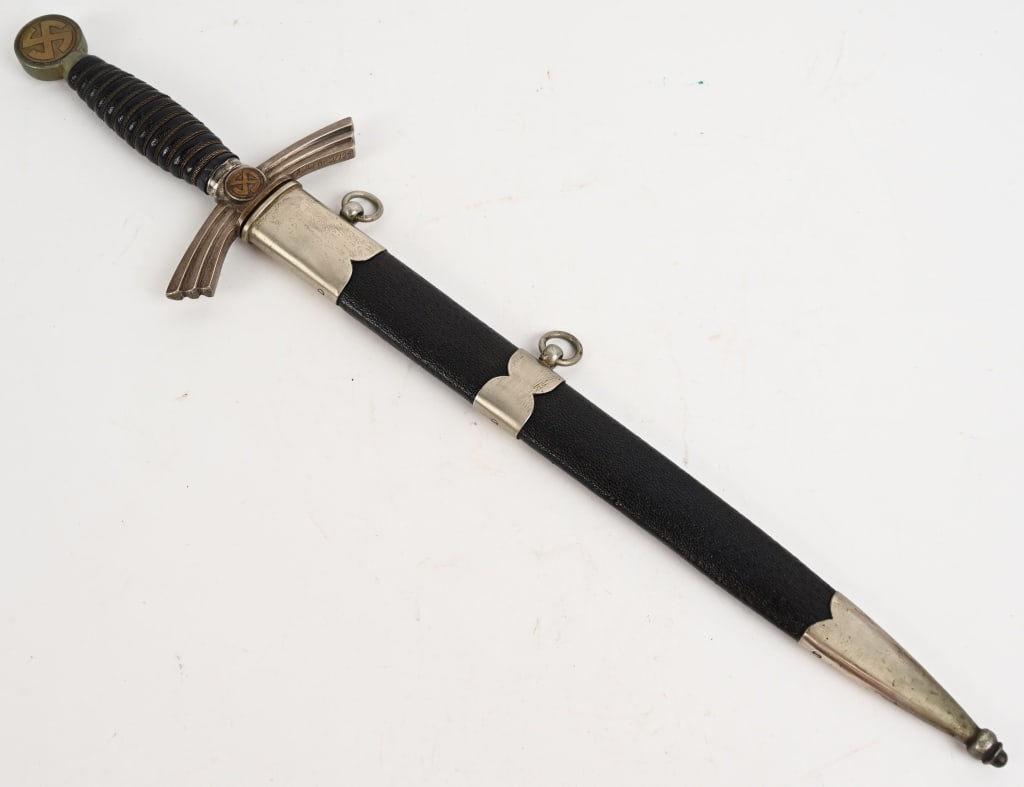 WWII NAZI GERMAN LUFTWAFFE DAGGER WEYERSBERG: 1st Model (1934/35) Luftwaffe dagger and hanger with nickel silver crossguard, pommel, and scabbard fittings. Blade marked Paul Weyersberg Solingen with their logo. Leather grip has minor wear with al