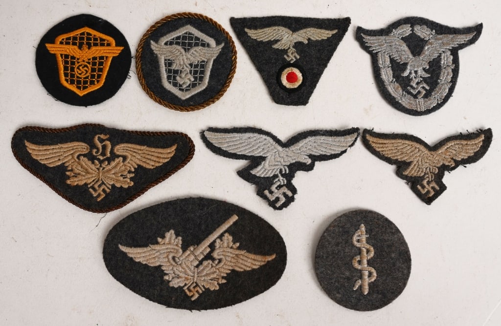 WWII NAZI GERMAN LUFTWAFFE INSIGNIA LOT WW2: Lot of Luftwaffe insignia lot to include 1) LUFTWAFFE MOTOR VEHICLE DRIVER'S TRADE BADGE. The badge consists of a Luftwaffe blue/gray wool base with a machine embroidered, stylized Luftwaffe eagl