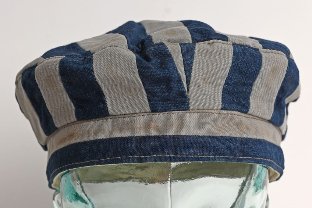 WWII NAZI CONCENTRATION CAMP INMATE UNIFORM CAP: This is a Jewish Concentration Camp Cap. Cap is lined and well marked to the interior 58 indicating size and named F. Wert and is maker marked Heiler Munchen 22 and ink stamped 28/IV indicat