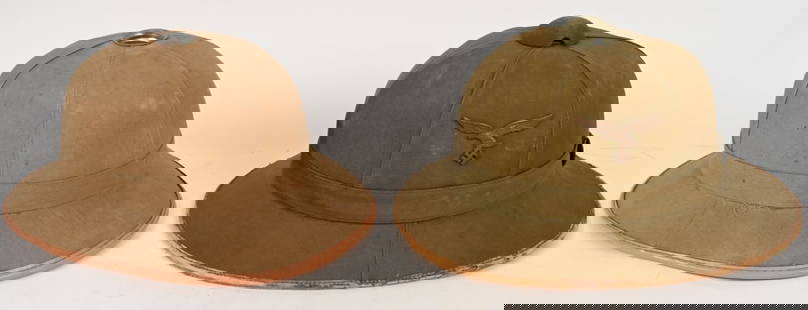 WWII NAZI GERMAN LUFTWAFFE PITH HELMET LOT: Lot of two Luftwaffe Tropical Pith Helmets to include 1) WWII NAZI GERMAN LUFTWAFFE TROPICAL PITH HELMET. Luftwaffe issue, tropical pith helmet, with a formed cork core covered in a ribbed, light tan/