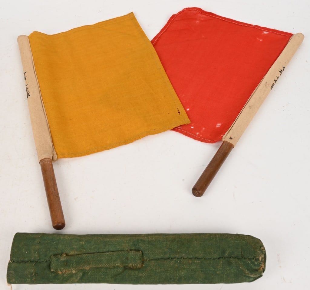 WWII IMPERIAL JAPANESE AVIATION SIGNAL FLAG SET: WWII Imperial Japanese Navy Semaphore Signal Flags With Kanji Marked Canvas Carrier. They are both of equal size, 12” x 10” flag on a 16 ½” wood dowel. These Semaphore flags are