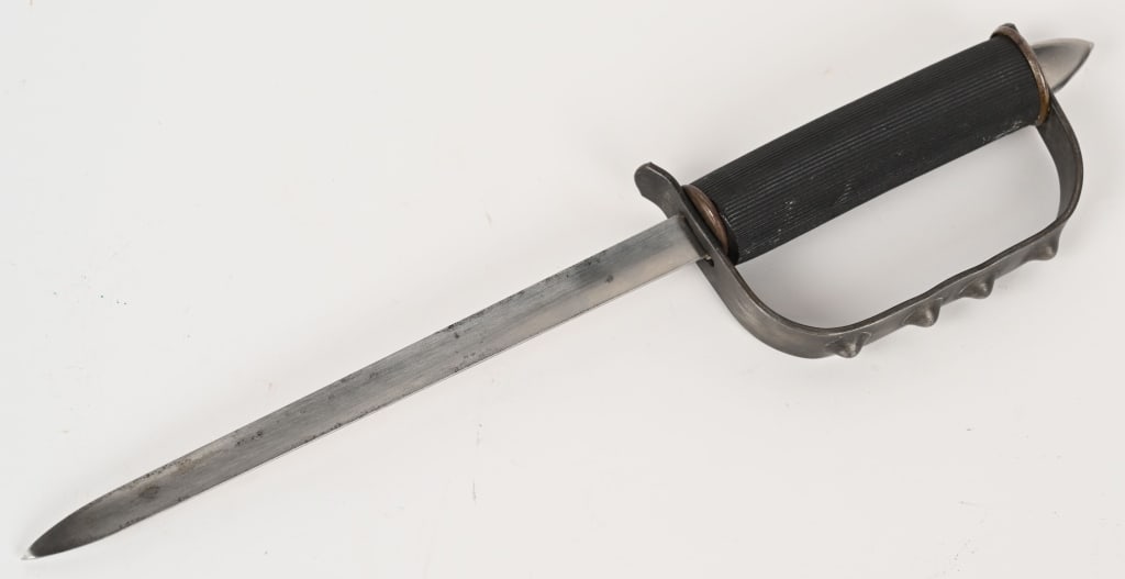 WW2 US OSS DROP KNIFE OFFICE OF STRATEGIC SERVICES: Little definitive information exists regarding these interesting WWII combat knives. Made from cut-down Trapdoor Bayonet blade, fitted with a simple rubber tube grip, and a stamped steel guard with fo