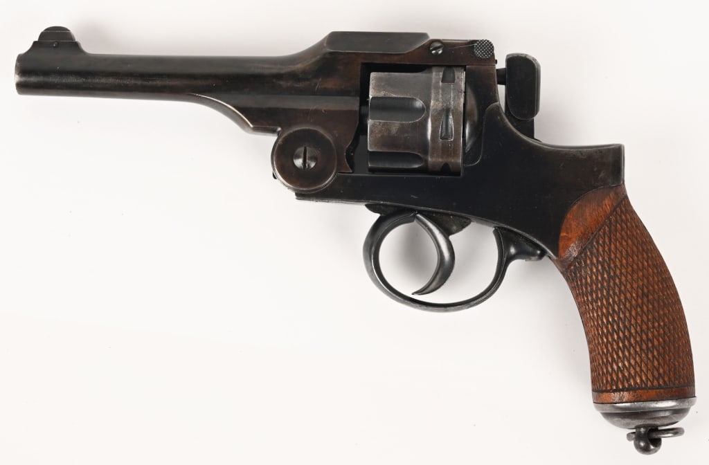 JAPAN TYPE 26 REVOLVER 9 MM NAMBU: SERIAL NUMBER: 23498. BARREL: 4 3/4". CALIBER: 9 MM NAMBU. MANUFACTURED: 1900s. Typical DA only design, made at the Koishikawa Arsenal. This example is known by collectors as a "standard production" g