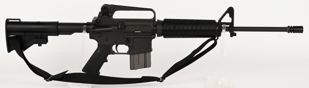 PRE BAN COLT AR-15 A2 GOVERNMENT CARBINE: SERIAL NUMBER: GC016383. BARREL: 16". CALIBER: .223 REM. MANUFACTURED: 1980/90s. "Pencil Weight" barrel, with "1/7" twist rate. A2 sights. Phosphate finish and A2 black polymer furniture. Includes pre