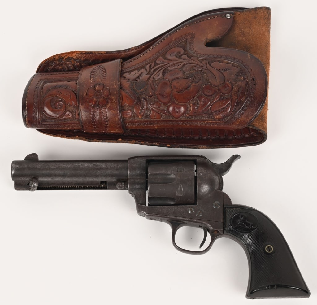BLACKPOWDER COLT SAA WITH HOLSTER: SERIAL NUMBER: 163238. BARREL: 4-3/4. CALIBER: .45 LC. MANUFACTURED: 1896. Finished blue with case hardened hammer. Correct two-line barrel address. Two-piece black hard rubber grips. Includes a squar