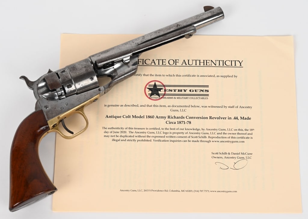 1860 ARMY COLT CONVERSION REVOLVER: SERIAL NUMBER: 199036. BARREL: 6-3/4". CALIBER: .44 COLT. MANUFACTURED: 1873. Finished blue with one-piece walnut grips Brass trigger guard and blued backstrap. CONDITION: Very clean with no original