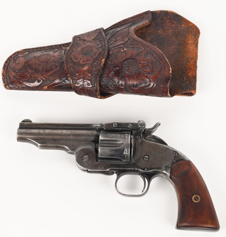 SHORTENED S&W SCHOFIELD REVOLVER: SERIAL NUMBER: 6569. BARREL 3-7/8". CALIBER .44 S&W. MANUFACTURED 1870s. Revolver is accompanied with a letter from Wendell Grangaard. The right side of the barrel is marked "W.F.& CO." . Two-piece wa