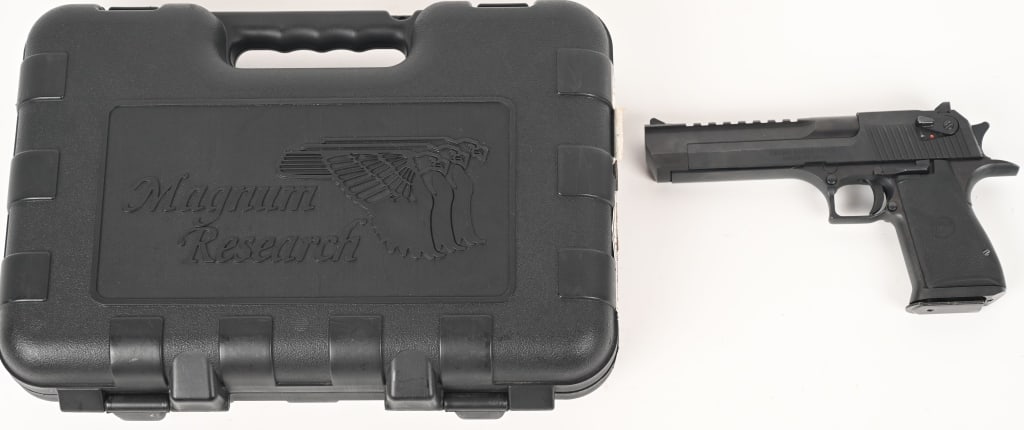 DESERT EAGLE 50 AE SEMI AUTO PISTOL: SERIAL NUMBER: DE0001696. BARREL: 6". CALIBER: 50 AE. Magnum Research Desert Eagle. Made in USA. This semi auto boomer features integral picatinny rail on top of slide, matte black finish, rubber grip