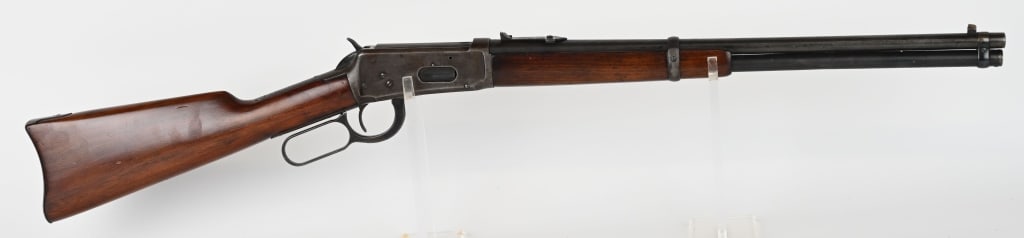 WINCHESTER1894 SADDLE RING LEVER ACTION RIFLE: SERIAL NUMBER: 354586. BARREL: 24". CALIBER: 25-35 WCF. MANUFACTURED: 1906. Finished blue. Two-piece plain walnut stock and forearm. Rifle style crescent butt plate. Standard barrel sights Saddle ring