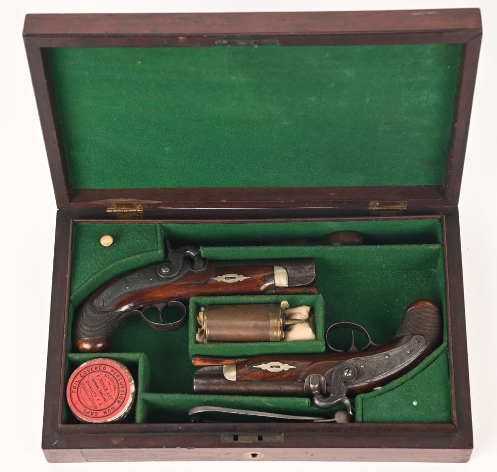 FINE CASED PAIR OF LONDON POCKET PISTOLS: .50 bore-percussion with a 4" barrel. Offered is a wonderful pair of London manufactured pocket pistols built along the lines of the Henry Deringer type. They are single shot, side hammer, percussion 