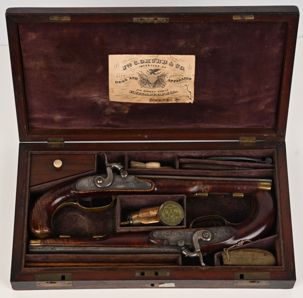 CASED SET OF SOWERS DUELING PISTOLS: SERIAL NUMBER: NSN. BARELS: 9 3/8". CALIBER: .44 bore percussion. This is a excellent matching set of Philadelphia dueling pistols. The engraved percussion locks are stamped JON n Sowers Philadelphia.