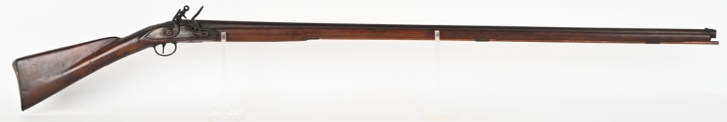 BRITISH KETLAND & CO. FLINTLOCK TRADE MUSKET: SERIAL NUMBER: NSN. BARREL: 45". CALIBER: About .65. Flintlock trade musket circa late 18th century. Features Ketland & co lock, round barrel with British proofs at breech, brass hardware and walnut s
