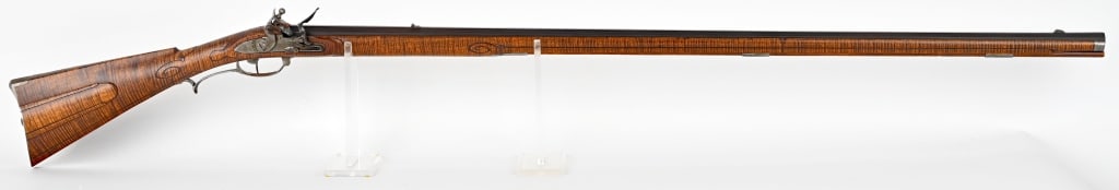 CONTEMPORARY BRIAN ANDERSON FLINTLOCK RIFLE: SERIAL NUMBER: NSN. BARREL: 46". CALIBER: .50. Fine contemporary flintlock rifle made in 1991 by Brian Anderson of Santa Fe New Mexico. features full length octagon barrel made by R. Paris & Son, carv