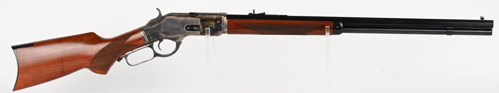 MODERN CIMARRON WINCHESTER MODEL 1873 REPLICA: SERIAL NUMBER: W95537. BARREL: 24". CALIBER: .45 COLT. Rifle is finished blue with case colored frame, lever & hammer. Checkered walnut stock and forearm. Rifle Style crescent buttplate. CONDITION: Li