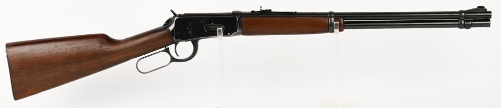 WINCHESTER MODEL 94 CARBINE: SERIAL NUMBER: 1957369. BARREL: 20". CALIBER: .30-30. MANUFACTURED: 1952. Rifle is finished blue overall. Plain walnut forearm and stock. Shotgun style steel butt plate. CONDITION: Fine overall with a