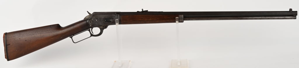MARLIN MODEL 1894 LEVER ACTION RIFLE: SERIAL NUMBER: 149936. BARREL: 26". CALIBER: .25-20. Rifle is finished blue with a case colored receiver. Plain walnut stock and forearm. Octagon barrel. Full length magazine. CONDITION: Fair overall