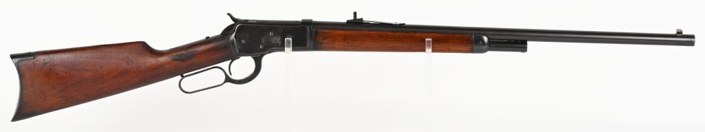 SPECIAL ORDER WINCHESTER MODEL 1892: SERIAL NUMBER: 242531. BARREL: 24". CALIBER: .38-40. MANUFACTURED:1902. Rifle is finished blue with case hardened lever & hammer. Plain walnut stock and forearm. Special ordered round barrel with half