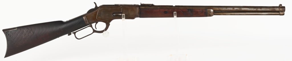 WINCHESTER MODEL 1873 LEVER ACTION RIFLE: SERIAL NUMBER: 498192B. BARREL: 21". CALIBER: .32-20. MANUFACTURED: 1894. Rifle is finished blue with case hardened frame. lever, & hammer. Plain walnut forearm and stock. Rifle style crescent buttpla